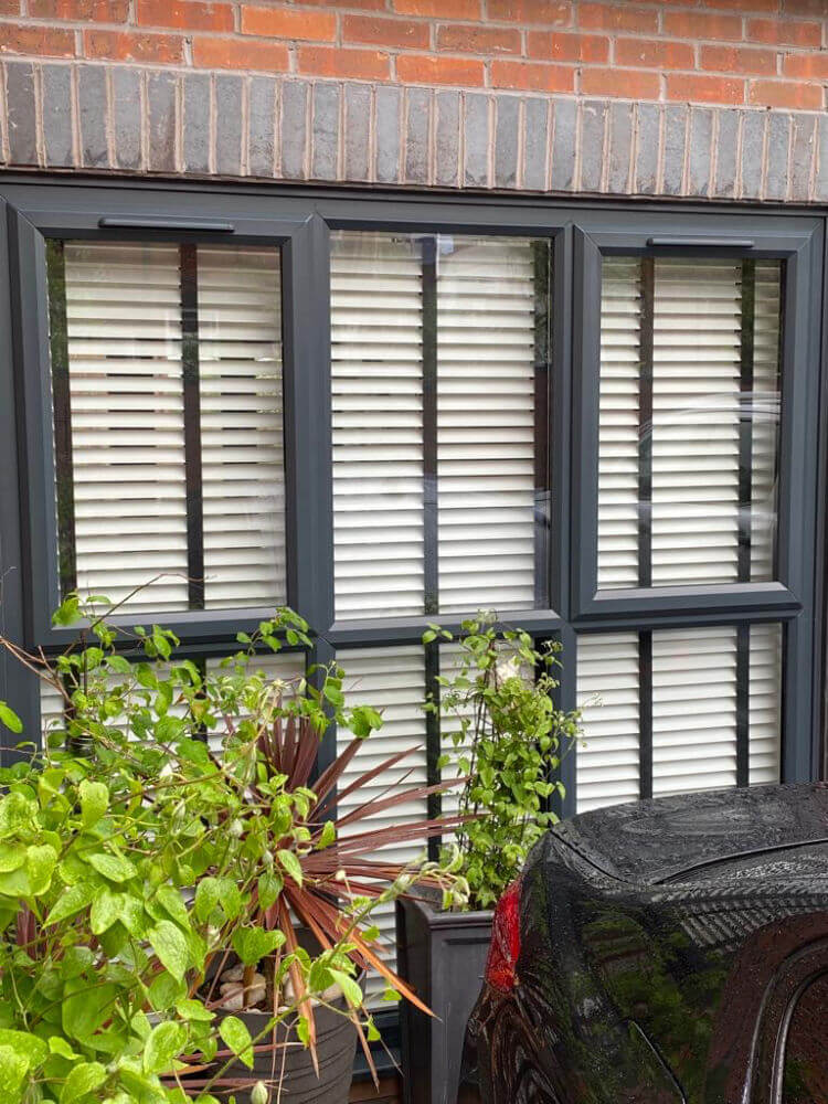 black window with venetian blinds