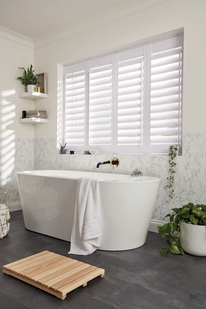 Bathroom with white shutters