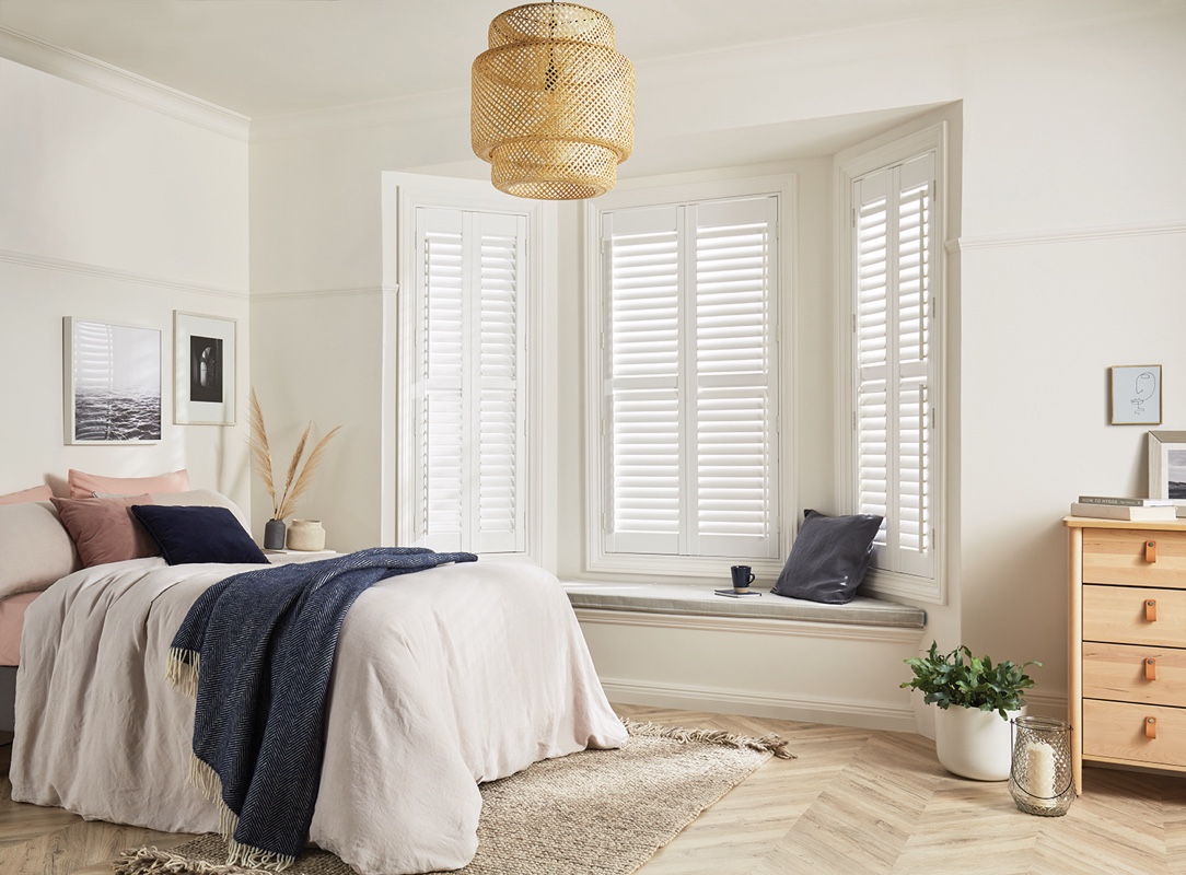 White shutters in a bedroom